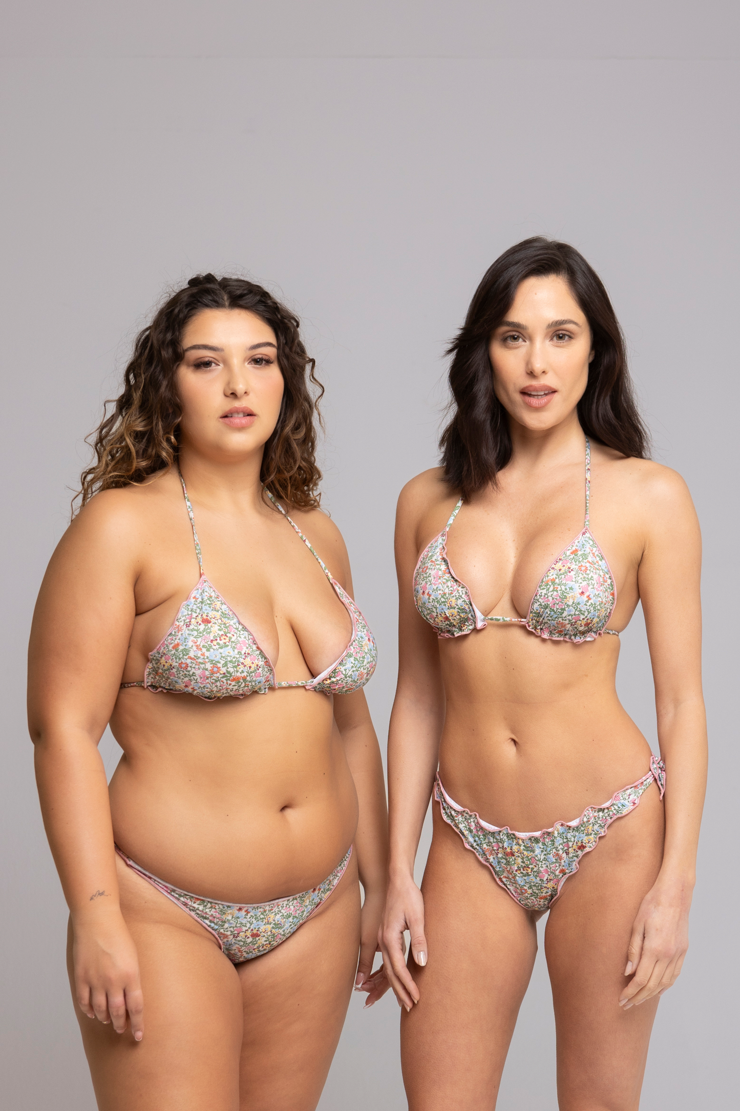 Two Model wearing Fru Fru Pink Floral Fantasy Triangle Bikini Set - front view - one in size small, one in size large
