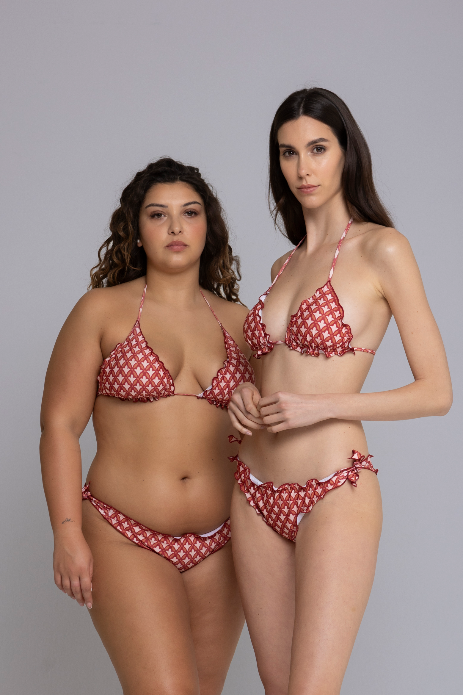 Two Models wearing Fru Fru Terracotta Fantasy Triangle Bikini Set - front view - one in size small, one in size large