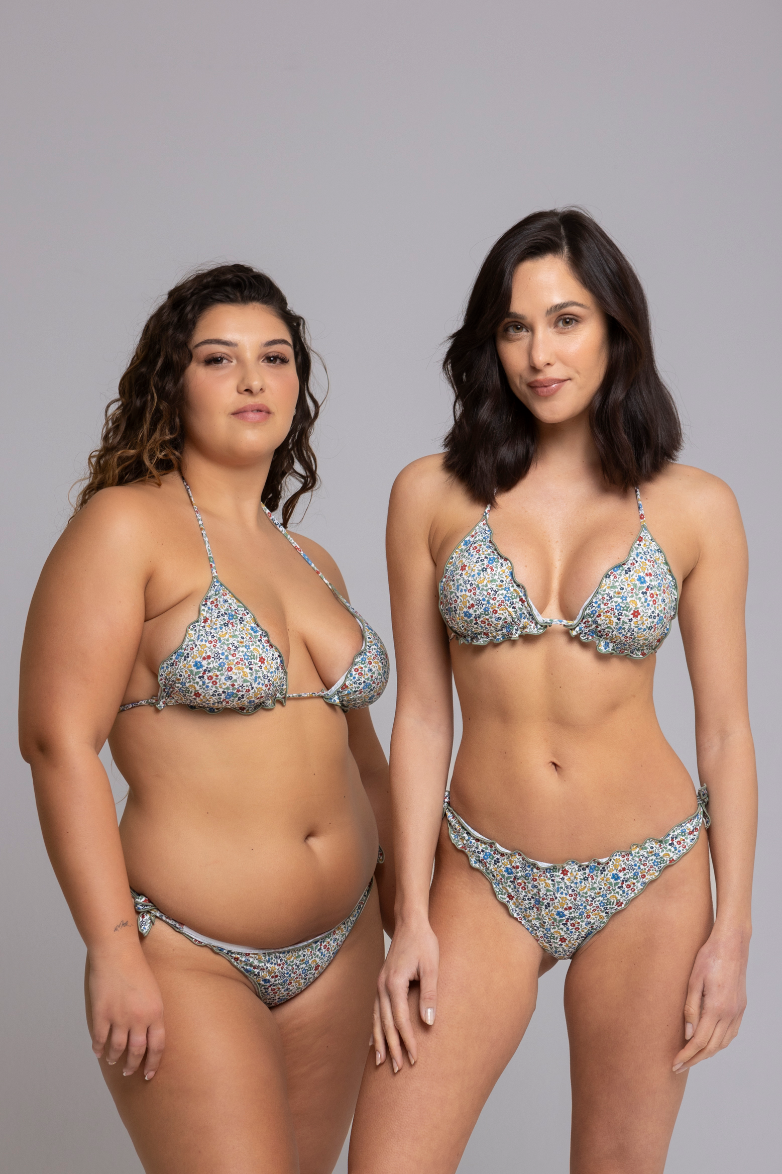 Two Models are  wearing Fru Fru Green Floral Fantasy Triangle Bikini Set - front view - one in size small, one in size large
